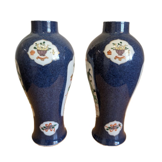 A beautiful pair of power blue glaze plus Wucai character and Bogu pictures vases with gilt edges. The "leaf" mark can be...
