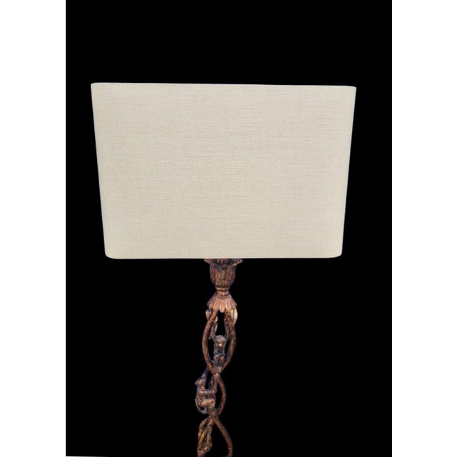 A wonderful tall 3 monkeys climbing tortoiseshell table lamp. The lamp features an iron body with a tortoiseshell like...