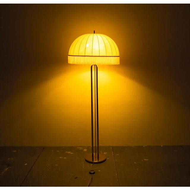 Minimal, geometric and simply shaped design. The lampshade is made of cotton with a fringe finish. The lamp creates a...