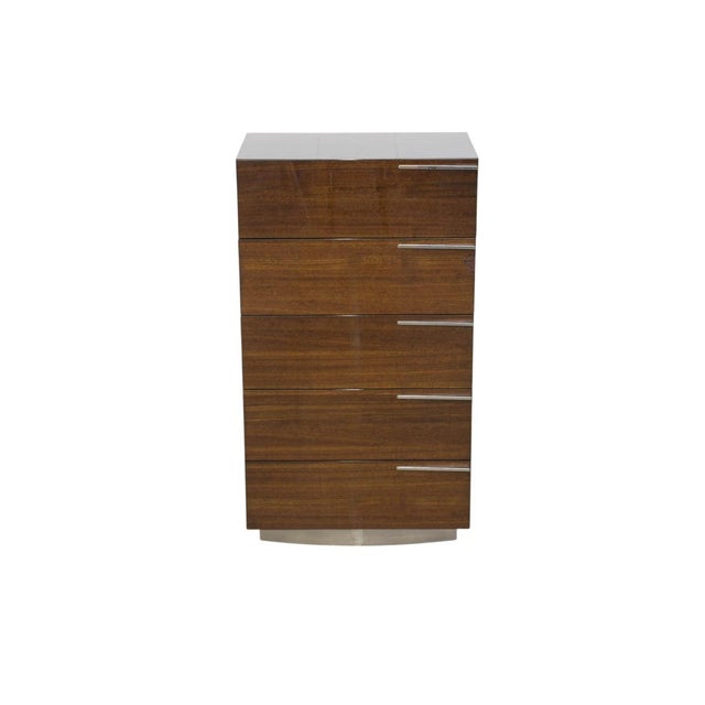 A refined tall chest purchased through Cantoni, this five-drawer piece combines rich high-gloss wood with clean...