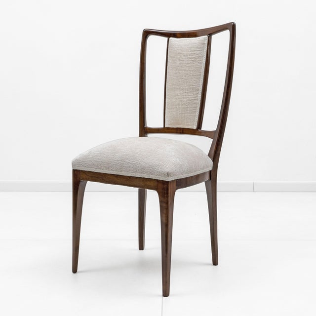 Elegant lines and a solid structure characterize this splendid set of eight dining chairs, in style of Osvaldo Borsani....