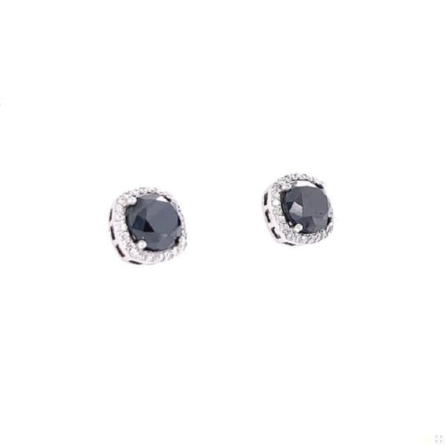 These unique stud earrings have 2 Black Round Cut Diamonds that weigh 5.42 Carats and 48 Round Cut Diamonds that weigh...
