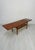 Beautiful vintage danish coffee table from the 1950s–1960s with elegant mid-century modern design, warm teak wood grain...