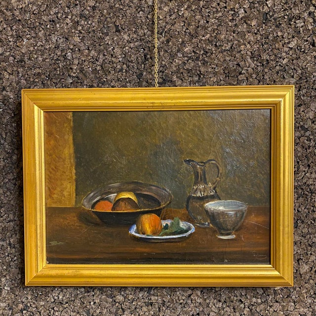 Early 20th Century oil painting depicting a tablescape with fruits and tableware. Signed lower right “a. Derain”. Oil on...