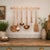 Beautiful vintage solid copper kitchen utensil set featuring six long-handled utensils with coordinating wall-mounted...