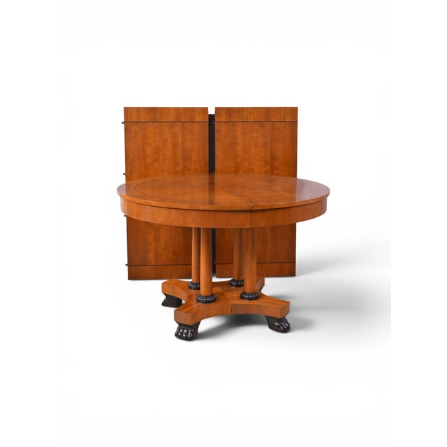 This is a timeless piece! It is an Empire or Biedermeier style dining / center table by Baker Furniture Company. It was...