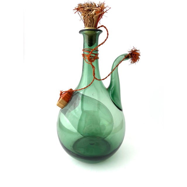 Here is a vintage blown glass wine demijohn made in Italy. This piece is quite the invention - you put ice in the inside...