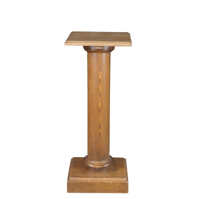 20th Century Mission / Arts & Crafts pedestal. Made from oak with a square top featuring a beveled edge over a neoclassic...