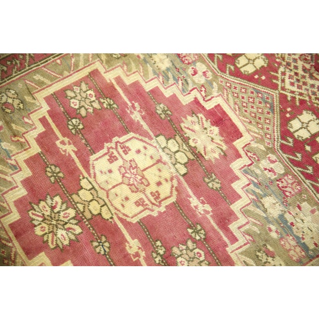 Introducing a one-of-a-kind vintage Turkish hand-knotted wool rug, carefully crafted by skilled artisans using traditional...