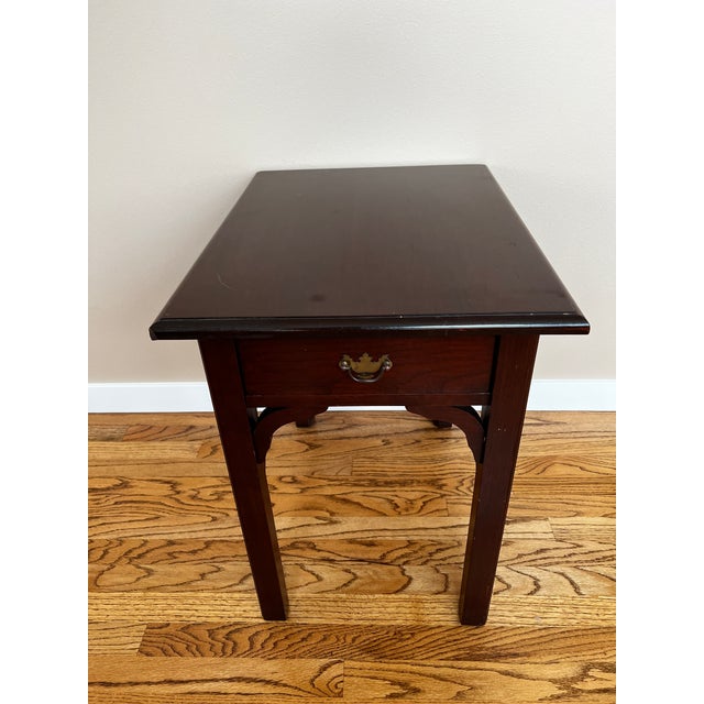 Simple and elegant cherry wood side table. Straight lines with stylish proportions. One drawer with a bronze rubbed pull....