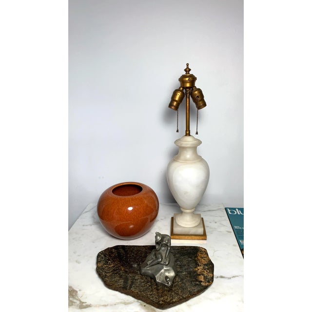 This early 20th century Neoclassical alabaster urn lamp will be a beautiful and elegant addition to you decor and design...