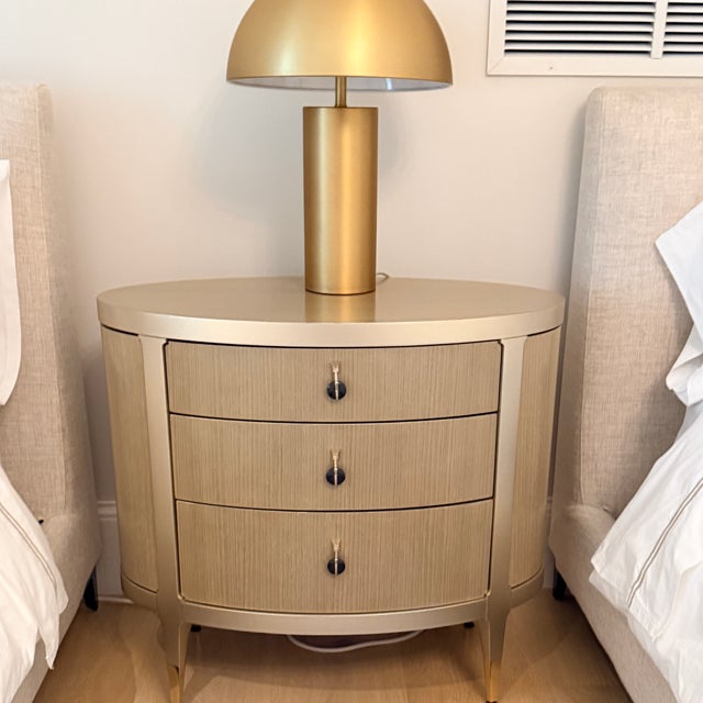 Caracaole A Dream Come True Nightstand An oval nightstand with updated mid-century lines. Curved Koto drawers are finished...