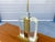 Bringing high-end Hollywood Regency luxury and mid-century modern glamour together, this striking 1970s table lamp was...
