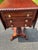 Empire styled mahogany sewing table. This bench made sewing table and made of solid mahogany with a rope edged detail. It...