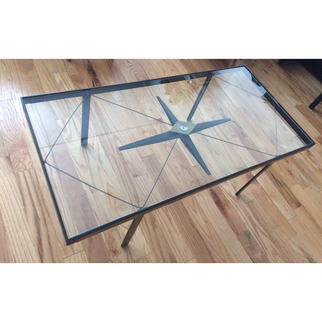 This is one of my favorite pieces! It is in excellent conditions, 1930 coffee table with wiring details, black and gold...