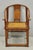 Antique Chinese Elm Hardwood Horseshoe Oriental Huanghuali Lounge Arm Chair with Woven Rattan Seat. Circa Early 20th...