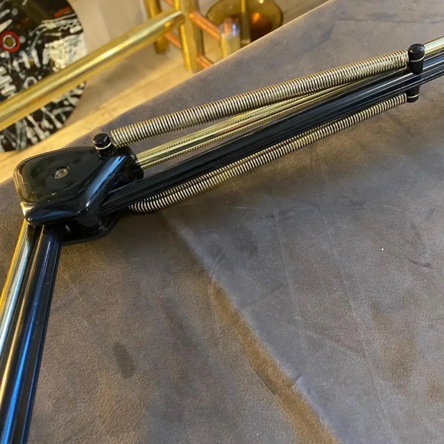 A gilt metal and plastic desk lamp designed and manufactured in Italy in the seventies in very good conditions overall....