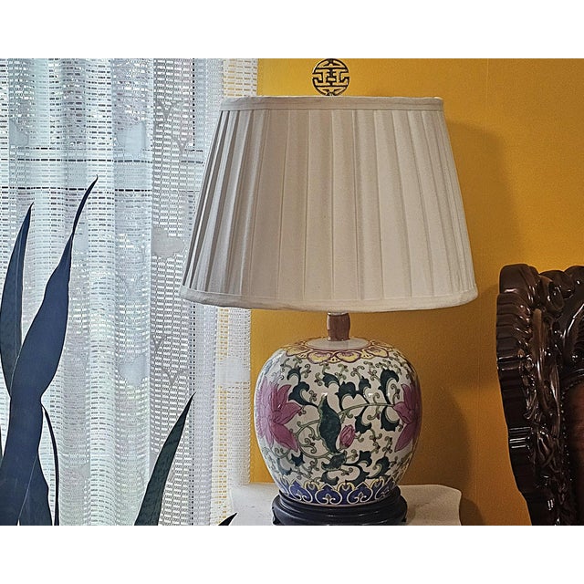 This elegant vintage Chinese famille rose porcelain ginger jar lamp showcases timeless Chinoiserie style with richly...