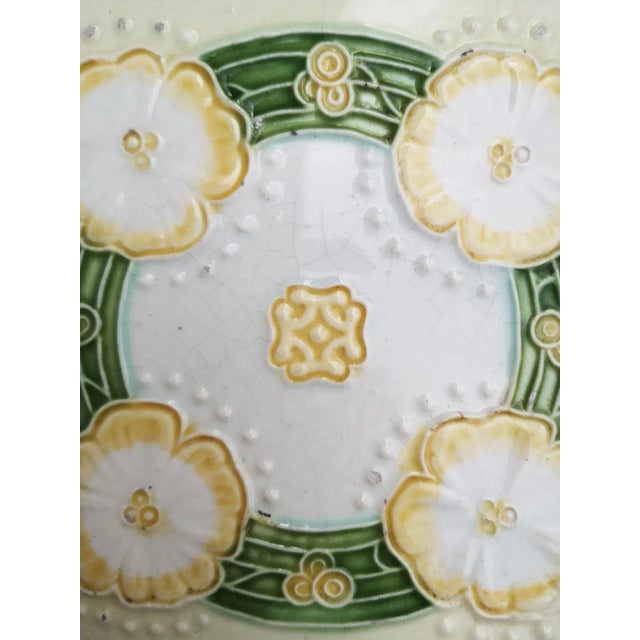 1 of the 28 unique and antique set of Art Nouveau handmade glazed relief tiles. Manufactured by NV Cermamiek produkten De...