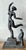 This powerful vintage sculpture captures a fluid, dynamic human form in motion, executed with the rough texture and...