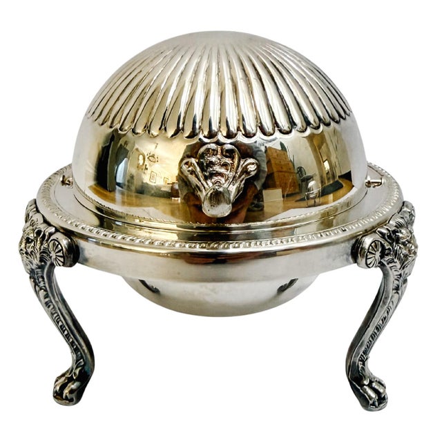 A classic American roll-top serving dish with a beautifully revolving chased dome lid by FB Rogers Silver Co. This...