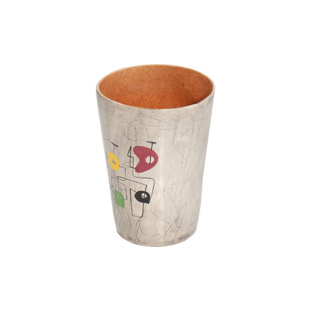 A mid-century WEG #13 vase by William Forauer and Elmer Gross. The round, tapered vase features a black, brown, and white...