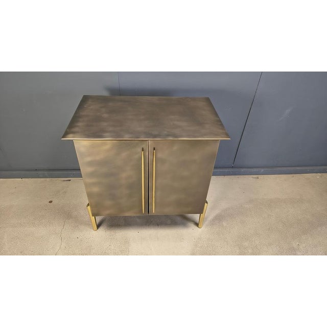 Beautiful brass/copper postmodern design cabinet by Belgochrom. Belgochrom used to make high quality furniture that was...