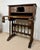 Impressive Spanish bargueño crafted from wood and richly decorated with carved details. The front features an elaborate...