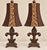 Striking pair of vintage table lamps featuring an elegant sculptural design with decorative wing-like forms and leopard-...