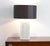 This marble table lamp is a design from the 1970s. The marble mosaic is fixed on a wooden base, and the copper inlay...