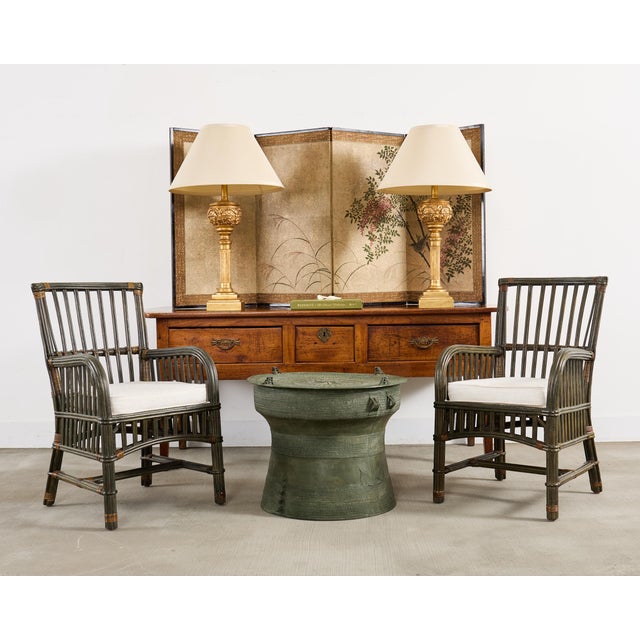 Gorgeous labeled pair of lacquered rattan and wicker dining armchairs made in the organic modern coastal style by Bielecky...