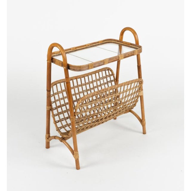 Midcentury amazing side table with magazine rack in bamboo, rattan and glass. Made in Italy in the 1960s.