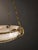 French Art Deco Alabaster and Brass Chandelier, 1930s An elegant French Art Deco chandelier from the 1930s, crafted in...