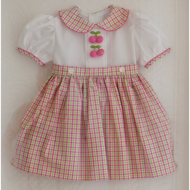 This listing is for a framed St. Louis Pink cherry dress in a wonderful white wood shadow box. The background fabric is a...