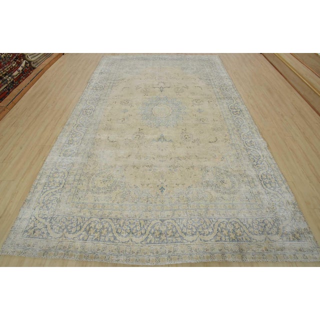 An authentic vintage traditional Kerman rug hand-knotted with fine wool and natural dyes. This oriental rug features a...