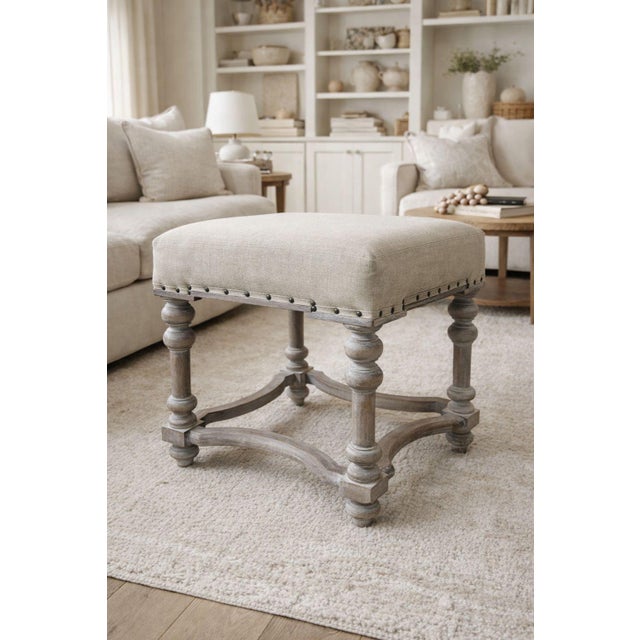 This handsome linen upholstered stool has many uses. It works with many styles from coastal to traditional. It could be...