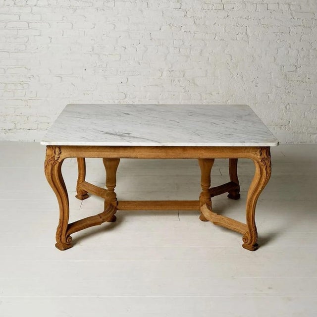 A thoroughly inviting 20th century French oak and marble farmhouse table, embodying the unpretentious warmth and enduring...