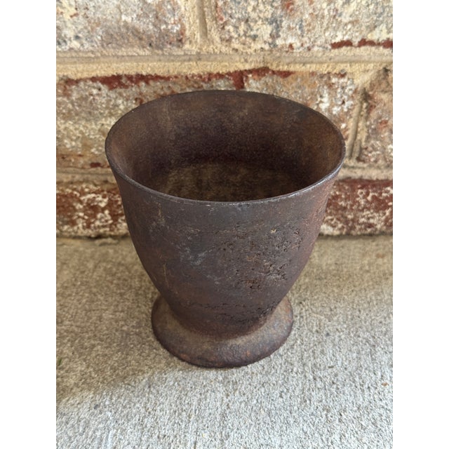 Antique cast iron apothecary mortar featuring a flared rim and a round pedestal base. This piece would also make a great...