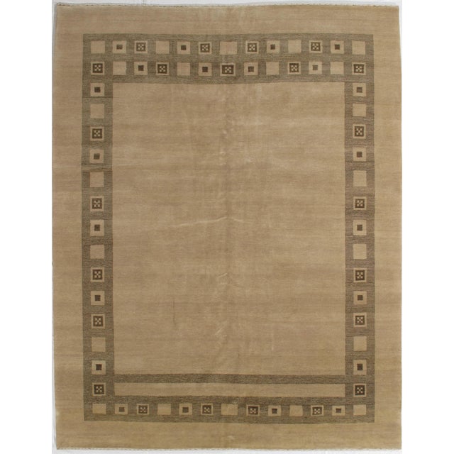 Vintage hand-knotted Indo Gabbeh rug with a plain field and geometric border of square motifs. Woven in wool with a...