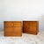 Constructed with teak veneer over plywood carcass. Each cabinet features two drawers fitted with distinctive sculpted...