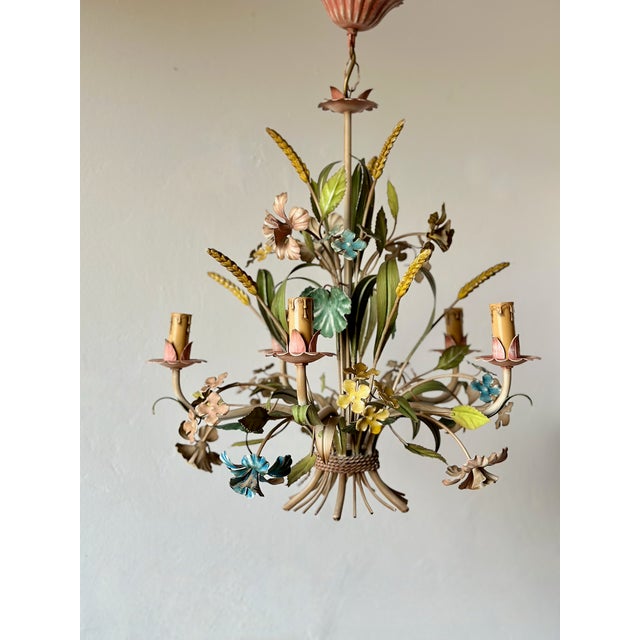 Vintage French polychrome tole chandelier dating from the 1960s. This five-light fixture is decorated with hand-formed...