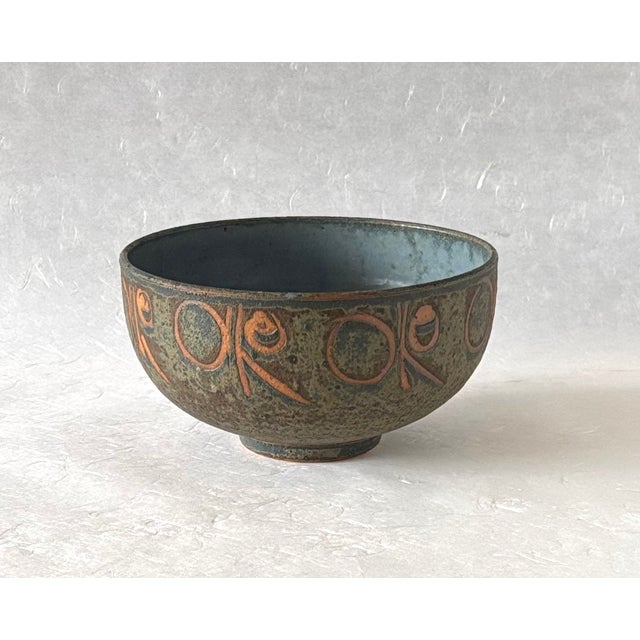 This wonderful handmade stoneware bowl feels very architectural in structure, yet loose and whimsical in it's surface...