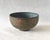 This wonderful handmade stoneware bowl feels very architectural in structure, yet loose and whimsical in it's surface...