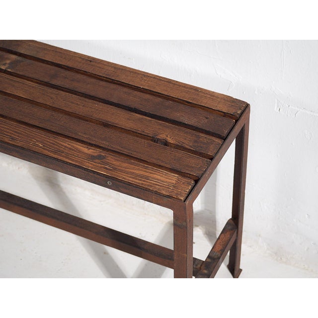 Long metal bench from a antique gymnasium (c.1920) We found this long metal bench in an antique school gymnasium....