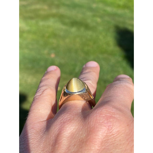 The Tionaga: Gentlemen's Signed Gemsco Tigers Eye Ring in Yellow Gold. Expertly crafted in yellow gold, this gentlemen's...