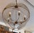 Design Plus Gallery presents the Chiron Collection Globe Chandelier from Mercana. Formed from metal in an antiqued gold...