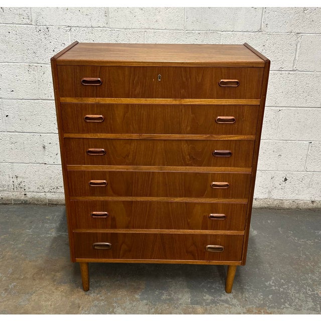 A classic piece of Danish mid century design that is both timeless in looks and extremely functional. This 6 drawer tall...
