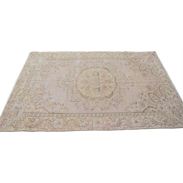 Washed out vintage faded rug from Oushak region of Turkey. Approximately 50-60 years old. In very good condition