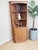A truly elegant Ercol Windsor corner unit, designed by Lucian Ercolani and dating from the 1980s, presented here in...