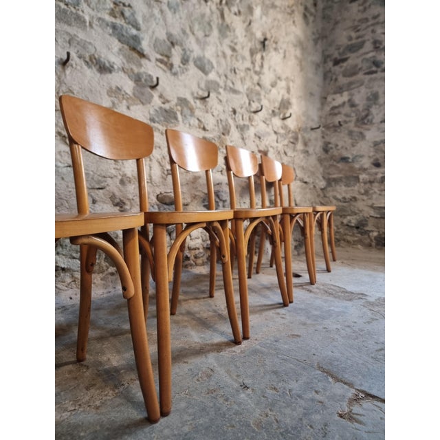 This set of six vintage French bistro chairs was produced by Luterma and dates from approximately the 1950s–1970s. The...